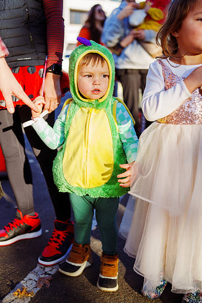 istock Young boy dressed up as a dragon trick or treating on Halloween 2242192600