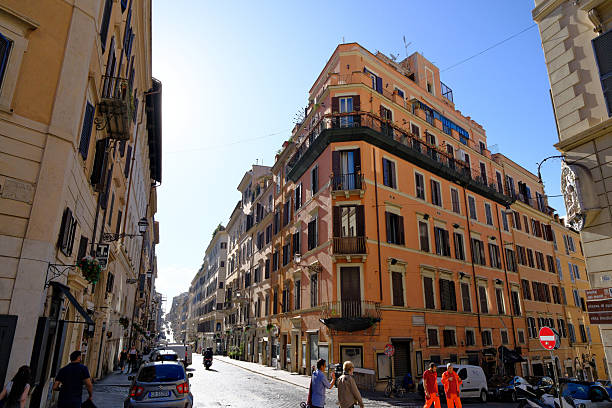 Rome,Italy-Sep.25th 2025: sunlit street in rome lined with classical buildings