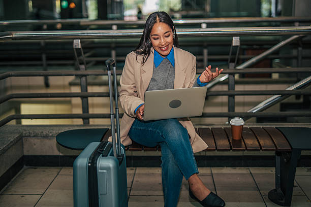 istock Woman traveling on business doing video call 2242195523