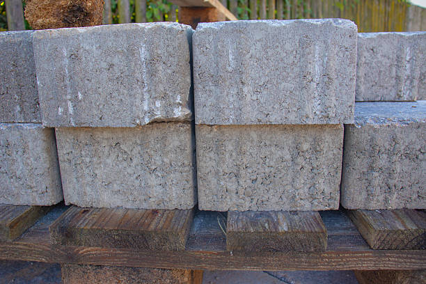 Stack of concrete blocks on a wooden pallet at a construction site