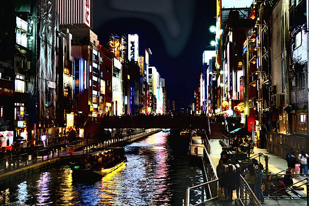 View of Dotonbori canal at night. Dotonbori is a famous commercial and nightlife area in downtown Osaka, Japan.