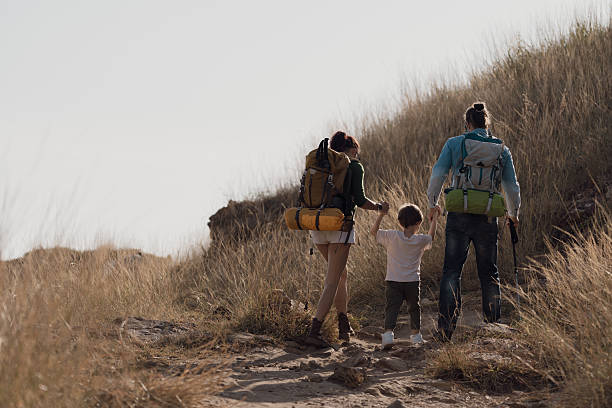 istock Parents are taking their son for a walk along the seaside to study nature resources. 2242200322