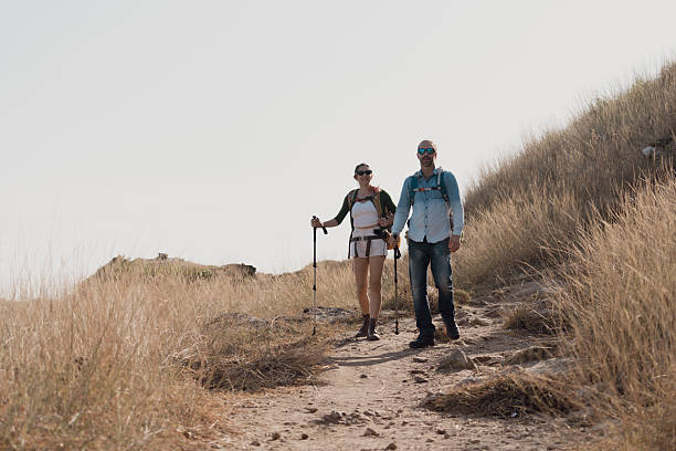 istock A couple goes for a walk along the seaside to study nature resources. 2242200376