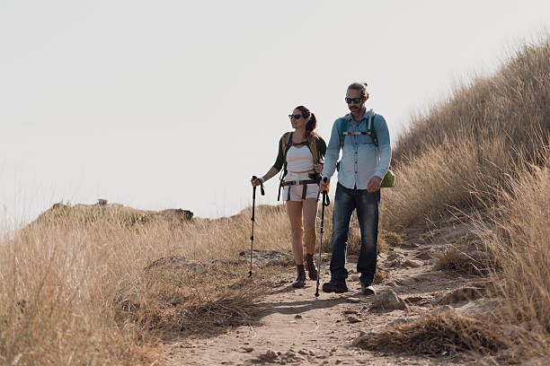 istock A couple goes for a walk along the seaside to study nature resources. 2242200427