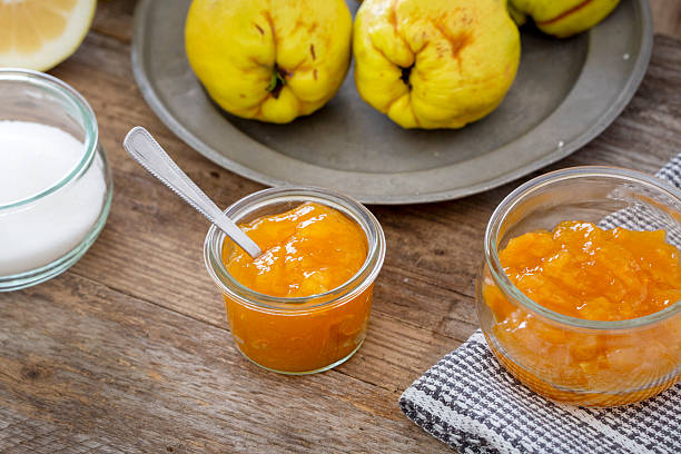 istock Quince, lemon and fresh jam on wooden table 2242207051