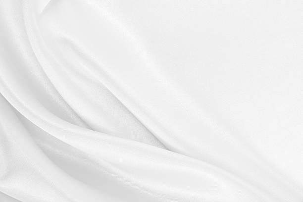 istock Smooth elegant white silk or satin luxury cloth texture as wedding background. Luxurious Christmas background or New Year background design 2242213665