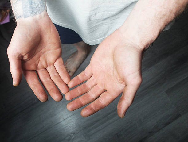 The guy shows the palms of his hands. Hand Reading Check.