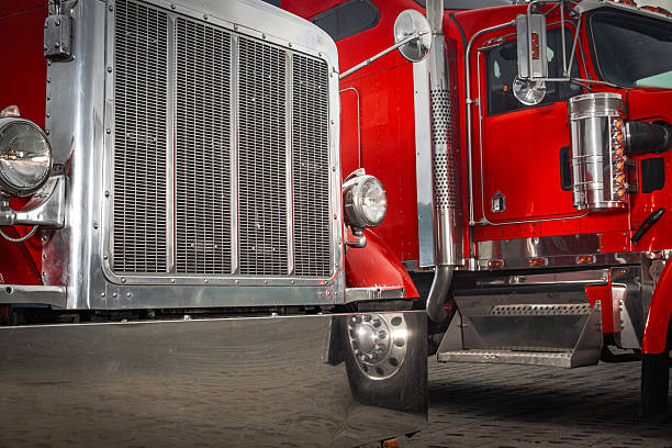 istock Two Classic Trucks Parked Side by Side Under Bright Sunlight at a Truck Yard 2242226917