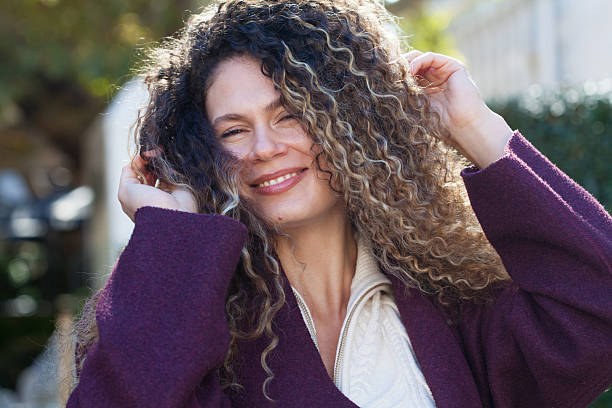 Young woman tossing hair