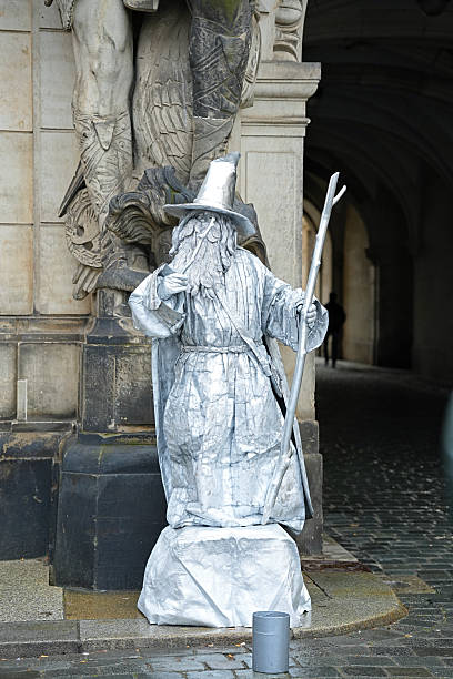 Dresden, Germany - December 10.2023 A made-up street performer who portrays a wizard character.