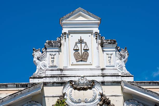 istock Historic building facade with justice scales and griffins. 2242234853