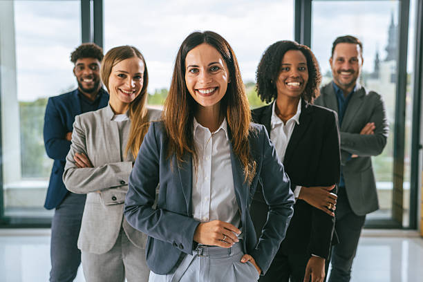 istock Diverse business team smiling standing in office 2242238541