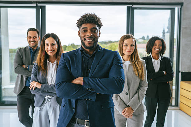 istock Diverse business team smiling confidently in modern office 2242238566
