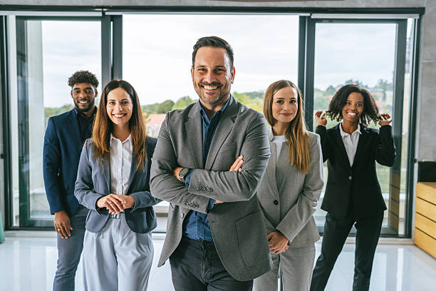 istock Diverse business team smiling standing in office 2242238637