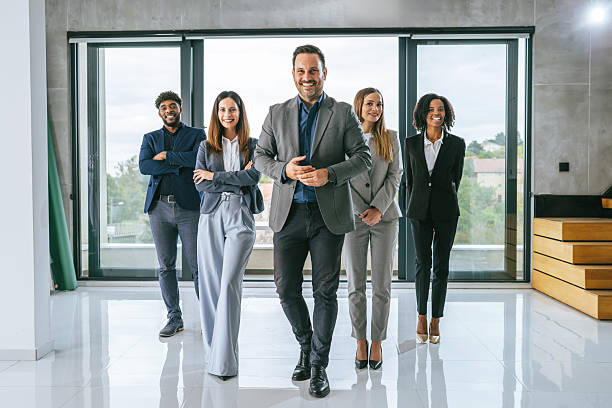 istock Diverse business team walking towards camera in office 2242238826