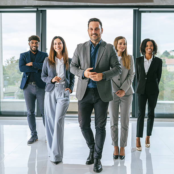 istock Diverse business team walking towards camera in office 2242238950