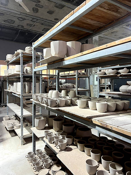 istock A ceramics workshop shows shelves filled with unglazed clay pots and vessels ready for final firing in a creative studio 2242239178
