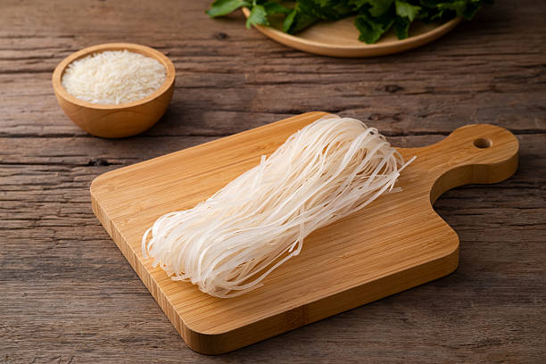 istock Thai died small rice noodles on wood board 2242239711