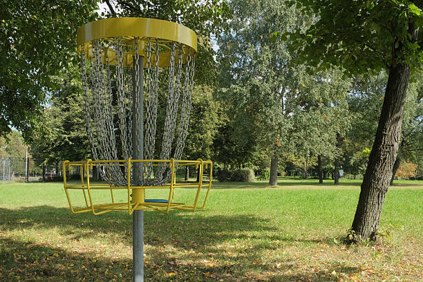 istock Disc Golf Target. Disc falls into metal chain basket 2242240622