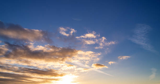 istock Sunset clouds are gathering. Panoramic sunrise or sunset sky with clouds. Sunset Sky on Twilight in the Evening with Sunset. Cloud Nature Sky Backgrounds. Sky Sunrise, Dusk clouds. 2242246007