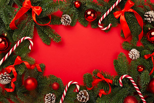 istock Christmas tree branches with festive decoration on color background, top view 2242246200