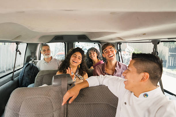 istock Chef guiding a small group of tourists in passenger van 2242246466