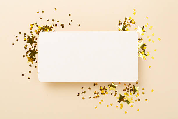 istock Golden star shape confetti on color background, top view 2242246599