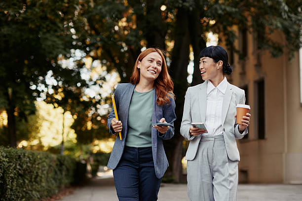 istock Professional Walk and Conversation Between Two Female Colleagues 2242247963