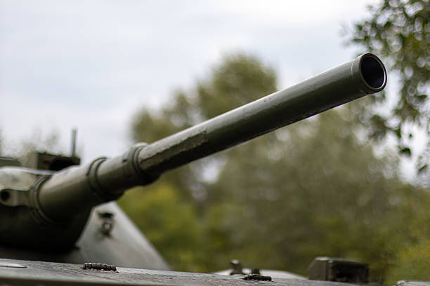 istock Tank Barrel Amidst Blurred Trees 2242251160