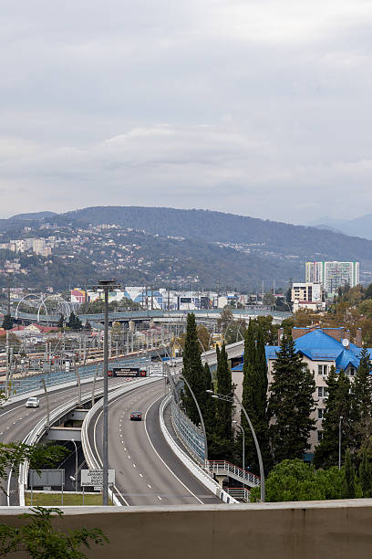 istock Elevated highway in urban valley 2242251769