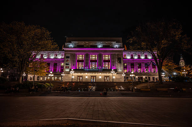 Palais Montcalm during autumn night in Quebec city lluminated in violot or pink for women's day