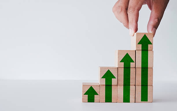 istock Business Growth and Development Concept. Hand Building Steps to Success. 2242257120