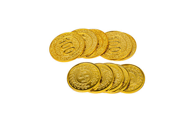 istock A large gold bar and several smaller gold ingots, accompanied by scattered gold coins, symbolizing wealth and investment, isolated on a white background Isolated. 2242269433
