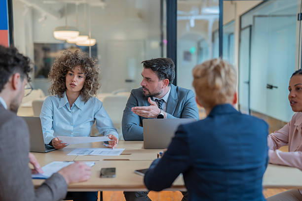 istock Business team discussing documents during office meeting 2242269930