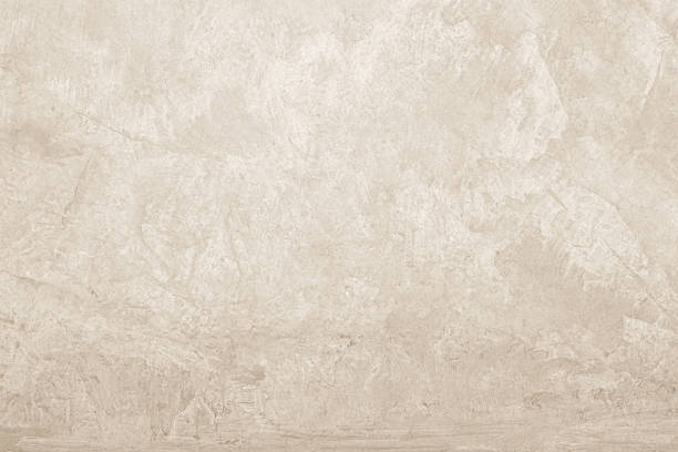 istock Colour old concrete wall texture background. Close up retro plain cream color cement wall background texture. Design paper vintage parchment element. 2242269988
