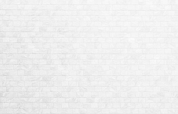 istock White brick wall background photo. Vintage white wash painted brick wall texture for stone tile block painted in grey light color wallpaper modern interior and exterior and backdrop design textured. 2242269997