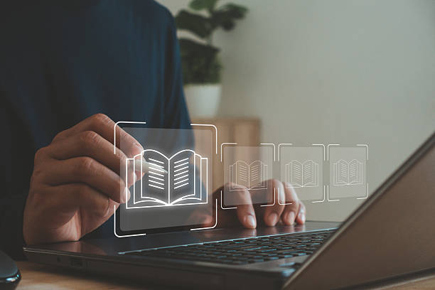 istock Businessman using laptop with digital book icon, concept of online learning, e-book library and education technology for knowledge development and digital transformation in modern education. 2242272558