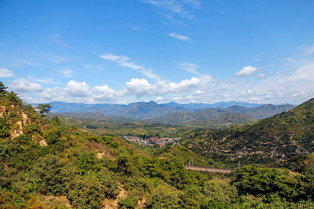 istock Scenic mountain landscape with lush greenery under a clear blue sky 2242276618