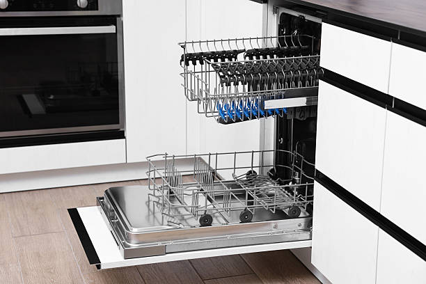 istock Open clean empty dishwasher in kitchen. Home appliance 2242288898