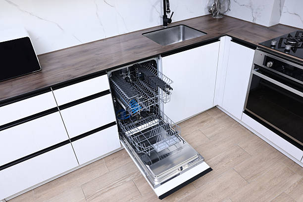 istock Open clean empty dishwasher in kitchen. Home appliance 2242288901