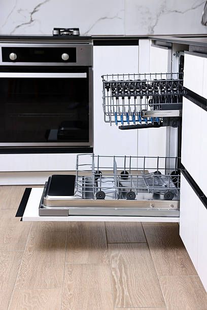 istock Open clean empty dishwasher in kitchen. Home appliance 2242288958