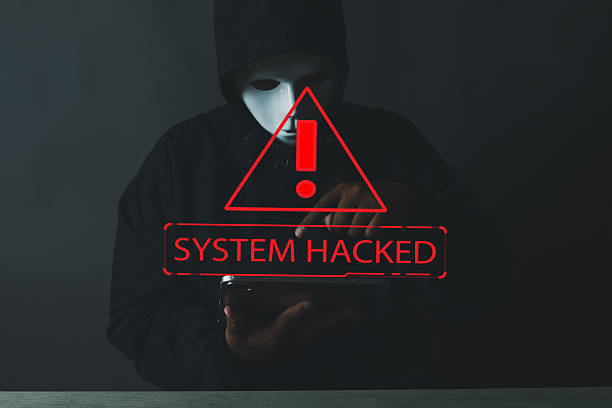 istock Online Security Threat: Hacker with mask, laptop, and 