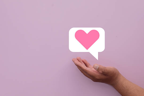 istock Love Message and Communication Concept: Hand Holding Heart Speech Bubble. 2242295151