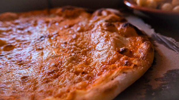 istock Four Cheese Pizza on Wooden Table 2242299477