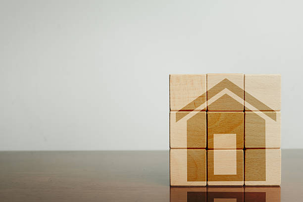 istock Real Estate Concept: House Icon on Wooden Blocks with Copy Space 2242307135