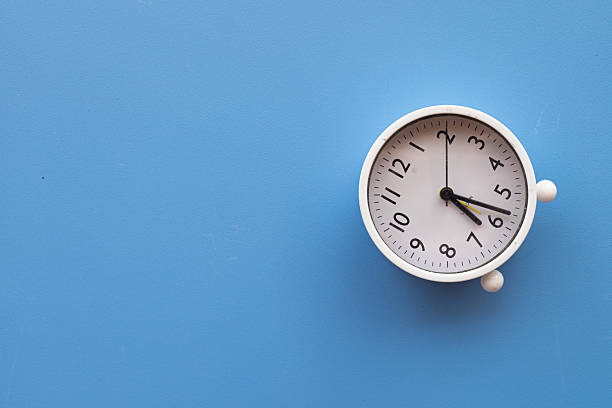 istock Time Management and Deadline Concept: Alarm Clock on Blue Background 2242307982