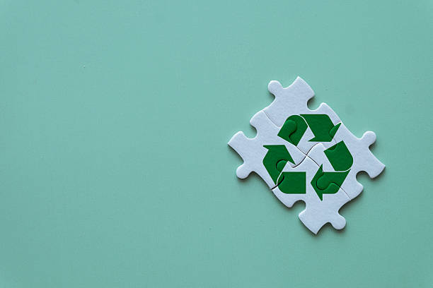 istock Sustainability Solution: Green Recycle Symbol on Jigsaw Puzzle 2242309145