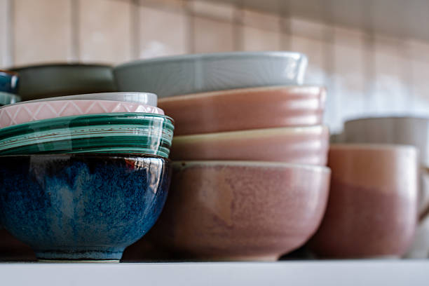 istock Dishes on the shelf, a stack of clean plates and bowls. 2242310678