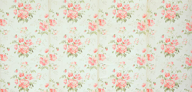 istock Old wallpaper on the wall. Old wallpaper for texture or background. 2242312311