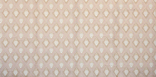 istock Old wallpaper on the wall. Old wallpaper for texture or background. 2242312564
